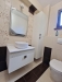 Mobilier baie din MDF vopsit cu riflaj și feronerie Blum