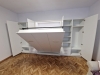 Mobilă cu pat rabatabil în Brașov, cu dulapuri laterale și depozitare integrată