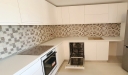 Mobilier bucătărie din MDF vopsit cu blat termorezistent – 5,3 m, montaj în Bacău