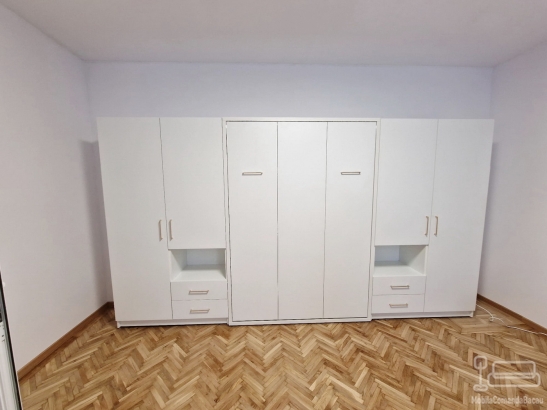 Dormitor cu Pat Rabatabil și Spații de Depozitare – Proiect Personalizat în Brașov