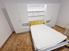 Dormitor cu Pat Rabatabil și Spații de Depozitare – Proiect Personalizat în Brașov
